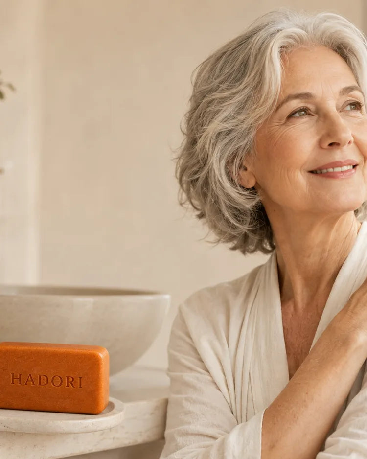 Older American woman in a calm bathroom with HADORI Japanese persimmon soap