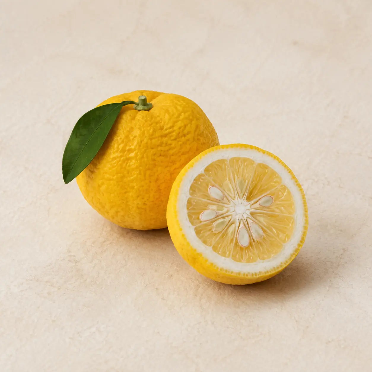 Whole and freshly cut Japanese yuzu fruit